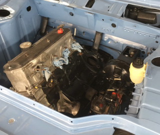 The original numbers-matching M10 goes back in the car!